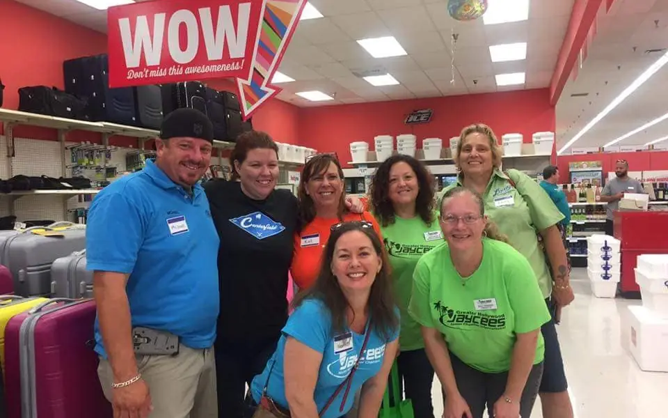 Eight volunteers in Jaycees shirts at the 2017 Back to School Shopping Spree